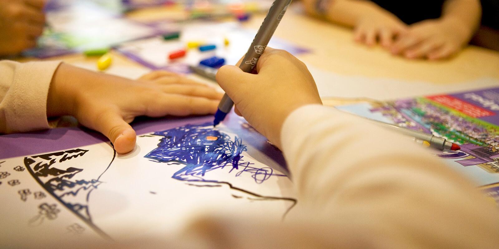 Photo of a childs hand drawing