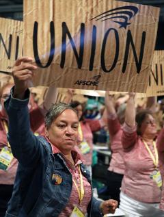 AFSCME member holds union sign at 2018 convention